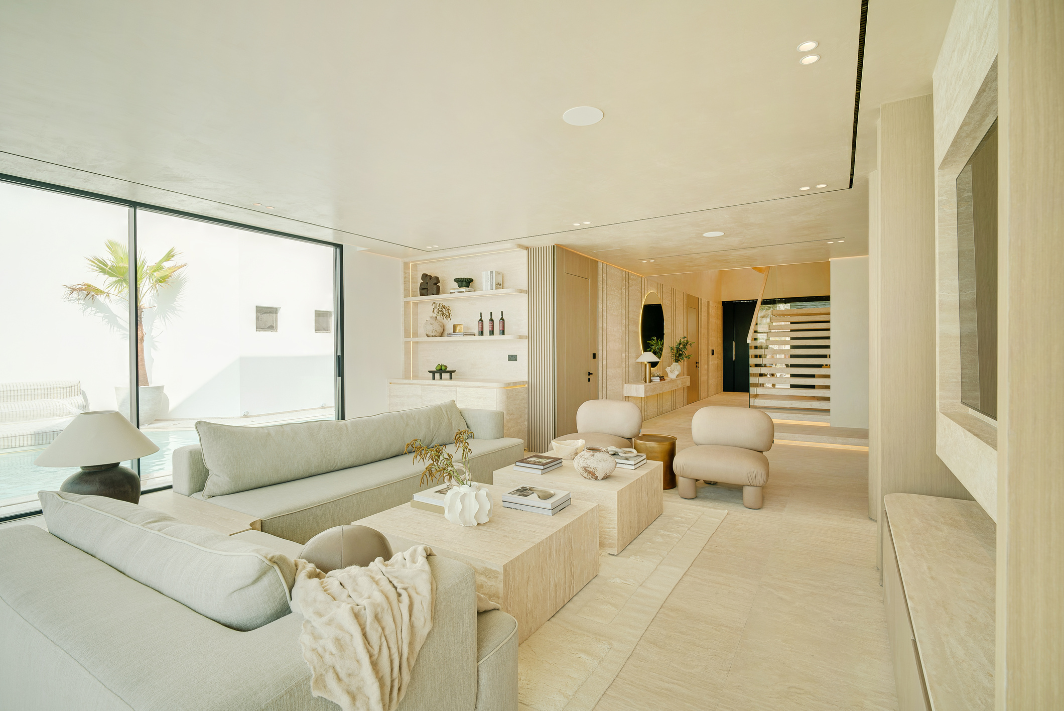Travertine living room opening to pool